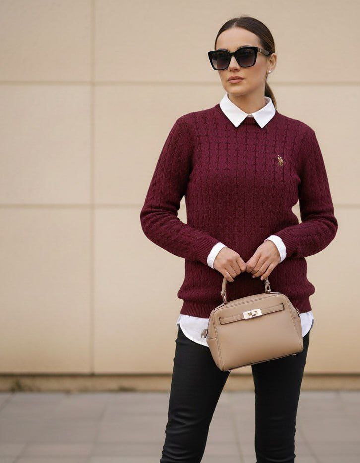 Woman wearing burgundy cable knit crewneck sweater