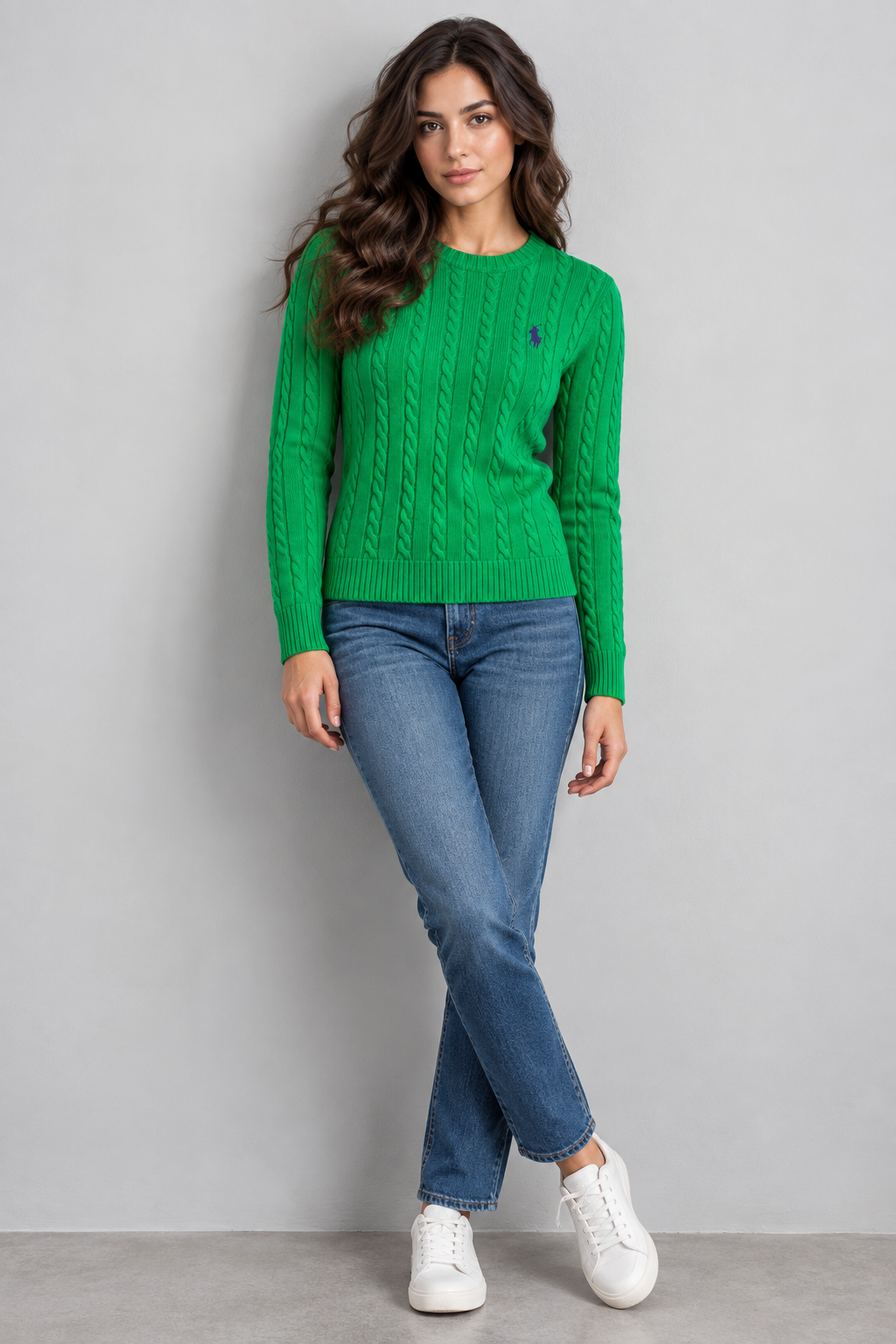Model wearing green RL Polo cable knit sweater with jeans