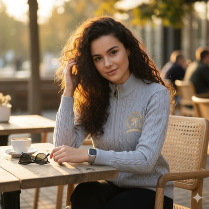 Model wearing gray cable knit zip-up cardigan